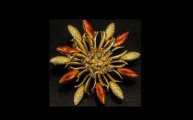 18ct Gold - Enamel and Sapphire Set Flower Brooch, Signed. A Striking Piece of Jewellery, The