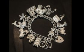 Vintage Good Quality Sterling Silver Charm Bracelet Loaded with 17 Silver Charms. All Matched for