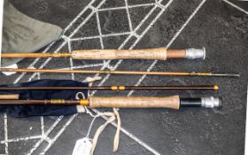 Fishing Interest - Two Fishing Rods in a Canvas Holder, to include a Hardy 275 cm. Together with a