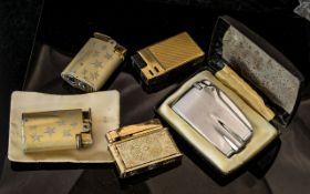 Collection of Vintage Lighters, comprising two Ronson Starfire Woodbridge star patterned lighters, a