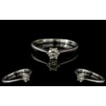 Platinum Single Stone Diamond Ring, set with a round modern brilliant cut diamond, claw set, fully