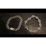 Two Fancy Link Silver Bracelets, one with cross and circular stye, with open box fastening, and