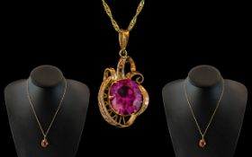 Ladies 9ct Gold Attractive Strung Pink Stone Set Ornate Pendant Attached to 9ct Gold Fancy Chain.