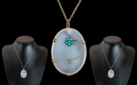 A Victorian Hard Stone Pendant, with mounted turquoise floral decoration, unmarked 9ct gold mount,