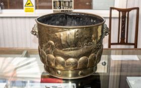 LARGE NEWLYN STYLE ARTS & CRAFTS PLANTER the embossed brass jardinière decorated with a lobed border