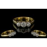 Ladies 18ct Gold Attractive 3 Stone Diamond Set Ring. Hallmark for London 2000. Also Marked 18ct -