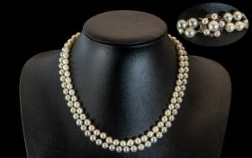 A Superb Quality Two Tone Cultured Pearl Necklace with 18ct Gold Ruby and Pearl Set Clasp. Marked