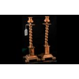 Pair of Copper Arts & Crafts Candlesticks, barley twist stick raised on column base with four square