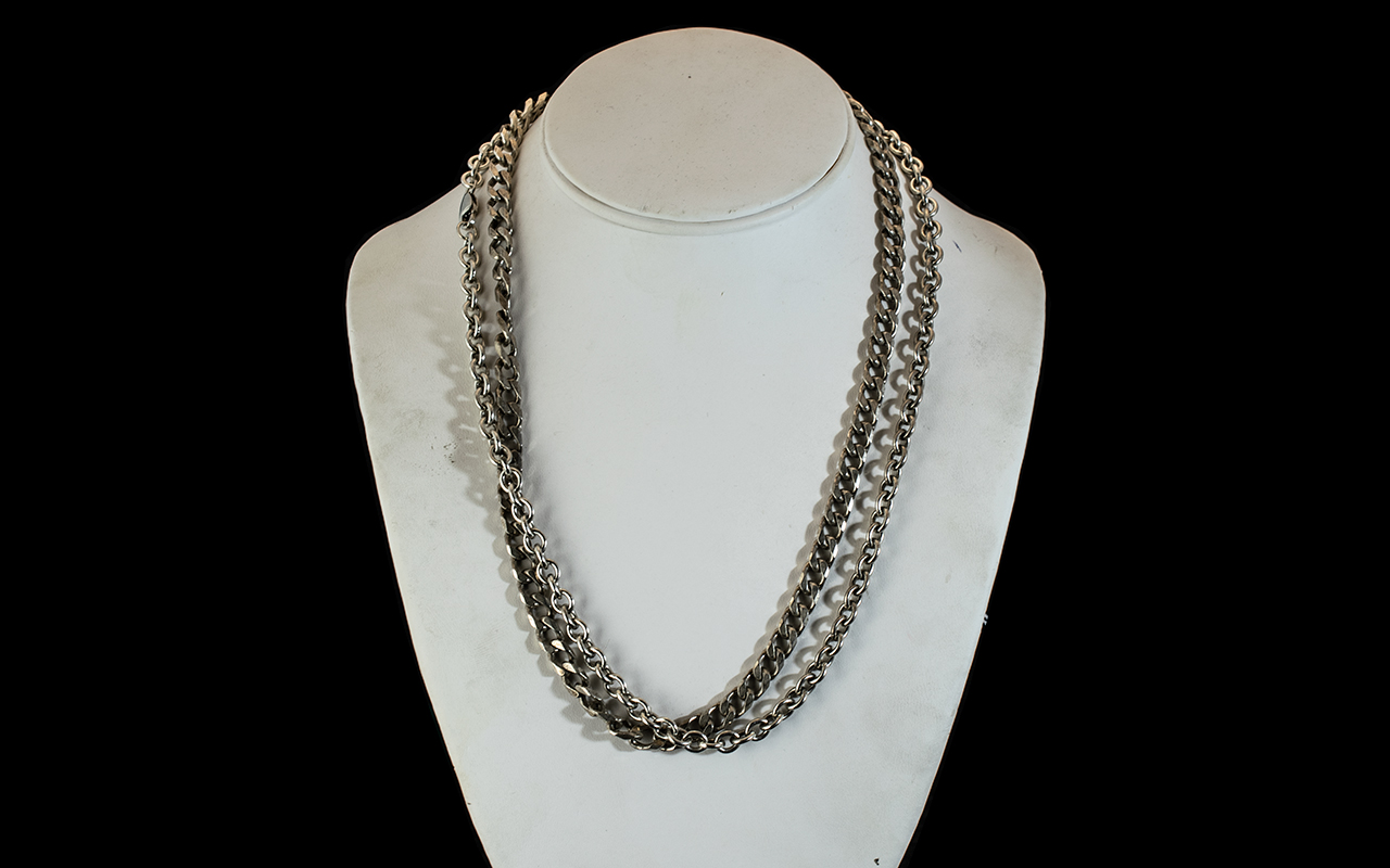 A Silver 20'' Flat Curb Necklace, together with a silver modern Belcher 20'' chain. Gross weight