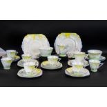 Art Deco Porcelain Tea Set, a fine quality painted set with floral decorations consisting of 8