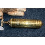 A 1922 Pyrene brass fire extinguisher
