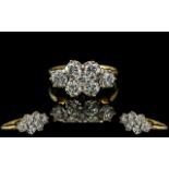 A Diamond Cluster Ring set with six round cut diamonds, approx 30 pts each, and a centre diamond