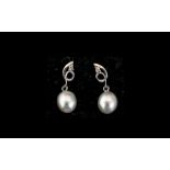 White Cultured Pearl Drop Earrings, single ovoid white pearls suspended from looped openwork with