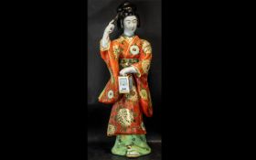 Large Oriental Figure of a Japanese Geisha, delicately coloured robes, holding a lantern. Measures
