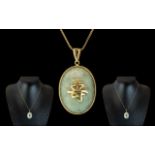 A Vintage 9ct Gold - Jade Set Pendant of Oval Form,