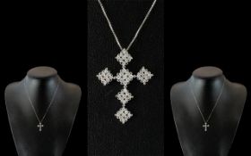 9ct White Gold Diamond Cross, set with 54 round brilliant cut diamonds, suspended on a 9ct white