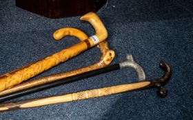 Collection of ( 5 ) Walking Sticks, One With Silver Plate Fancy Design Handle.