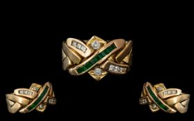14ct Diamond & Emerald Knot Ring, set with a row of square cut emeralds, princess cut diamonds
