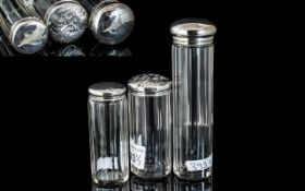 Three Silver Topped Cut Glass Bottles. Sizes Approx 8.5 , 14, 8.5 cms High. Hallmarked to Each.