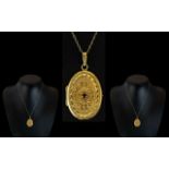 18ct Gold Oval Shaped Ruby Set Hinged Ornate Locket of Excellent Workmanship,