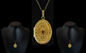 18ct Gold Oval Shaped Ruby Set Hinged Ornate Locket of Excellent Workmanship,