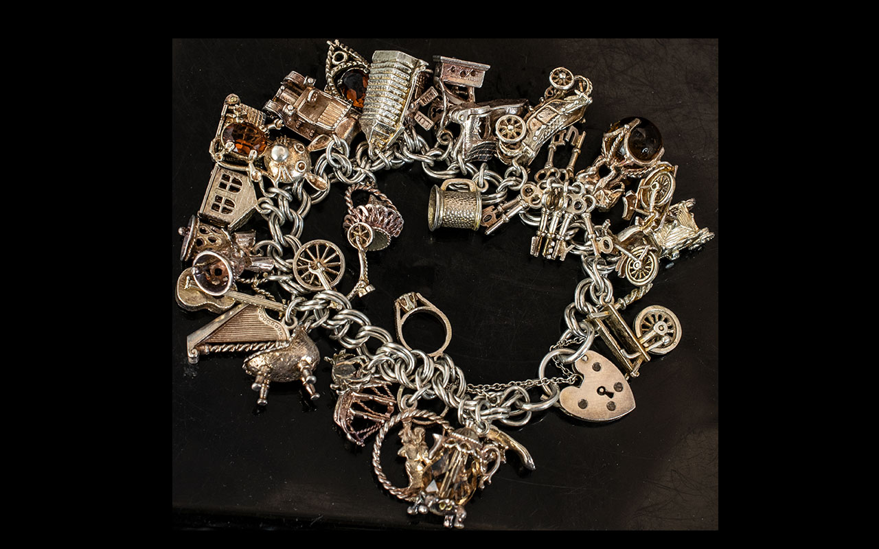 Vintage Heavy Silver Charm Bracelet Loaded with Charms.