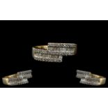 Ladies Nice Quality 9ct Gold - Diamond Set Designer Ring. The Baguette and Brilliant Cut Diamonds of