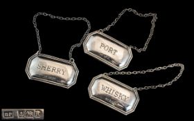A Fine Trio of Hallmarked Sterling Silver Spirit Labels. Comprises 1/ Sherry. 2/ Port. 3/ Whisky.