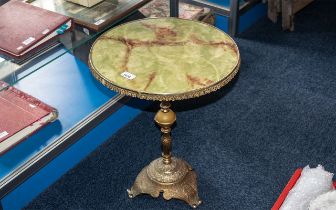 Circular Faux Marble Topped Side Table, raised on a brass pedestal,