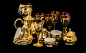 A Gilt Tea Service comprising coffee pot, 6 cups and saucers, sugar bowl and lid and milk jug.