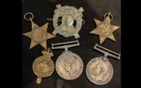 World War II Collection of Military Medals / Cap Badges. Not Named. Comprises 1/ Africa Star.