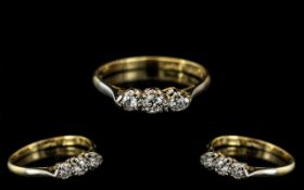 18ct Gold and Platinum Attractive 3 Stone Diamond Set Ring of Small Proportions. Marked 18ct and