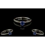 18ct Sapphire & Diamond Ring, central sapphire set between brilliant cut diamonds. Fully hallmarked.