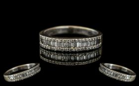 18ct White Gold - Attractive Brilliant and Baguette Cut Diamond Half Eternity Ring. Full Hallmark