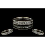 18ct White Gold - Attractive Brilliant and Baguette Cut Diamond Half Eternity Ring.