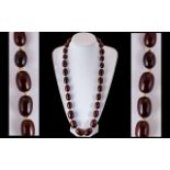 Faux Cherry Amber Double Knotted Barrel Shaped Beaded Necklace.