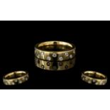 9ct Gold 16 Diamond Set Eternity Ring, fully hallmarked, ring size H. Weight 4.80 grams.