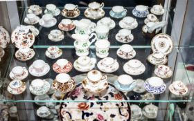 Collection of Miniature Cups & Saucers, including two Coalport trios,