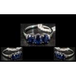 Sapphire and Diamond Trilogy Ring, three oval cut sapphires, totalling 3cts,