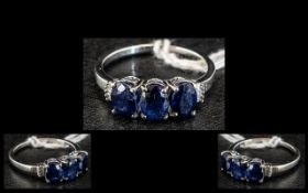 Sapphire and Diamond Trilogy Ring, three oval cut sapphires, totalling 3cts,