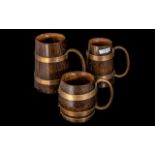 A Collection of Three Oak Tankards Copper Banding and Handles.