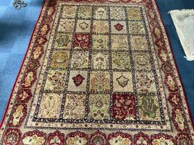 Large Wool Rug, Beige ground with red designs depicting animals, fruit trees, and flowers.