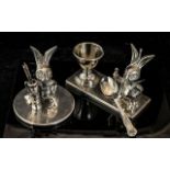 Two Table Top Stainless Steel Ornaments comprising an egg cup stand with spoon,