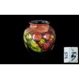 Moorcroft Vase 'Pomegranate' measures 5" tall. Marked to base 'Moorcroft' and signed.