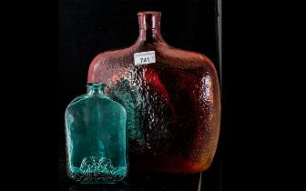*WITHDRAWN*Two Modern Glass Decanters, on large red dappled effect 11.