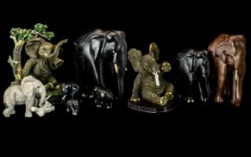 A Collection of Ornamental Elephant Figures (9) in total. A Mixture of modern and vintage items,
