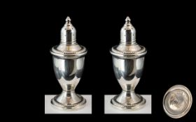 A Fine Pair of Sterling Silver Pepperettes of Pleasing Form.