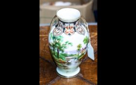 Noritake Twin Handled Vase, decorated with house and lake scene, measures 7.5" tall.