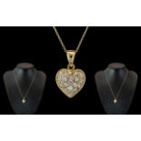 18ct Gold Attractive Diamond Set Heart Shaped Pendant with Attached 9ct Gold Chain.