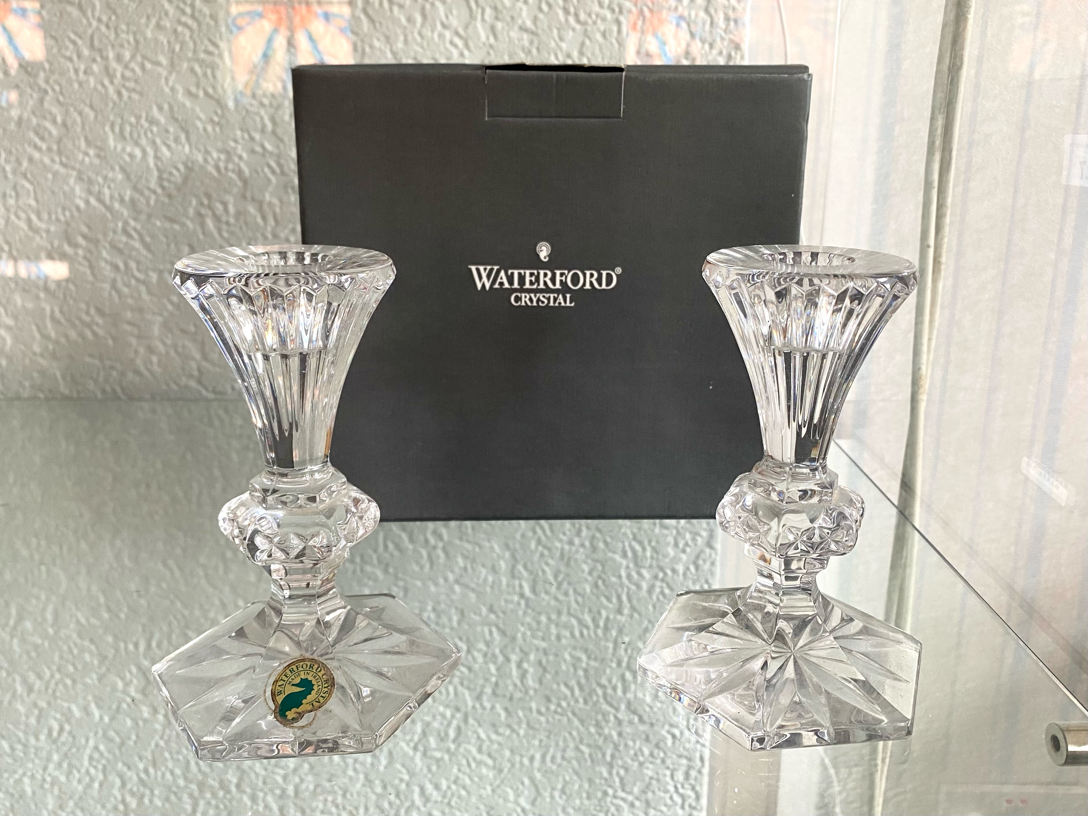 A Pair of Waterford Crystal Candlesticks, in original box, measure 5'' high.